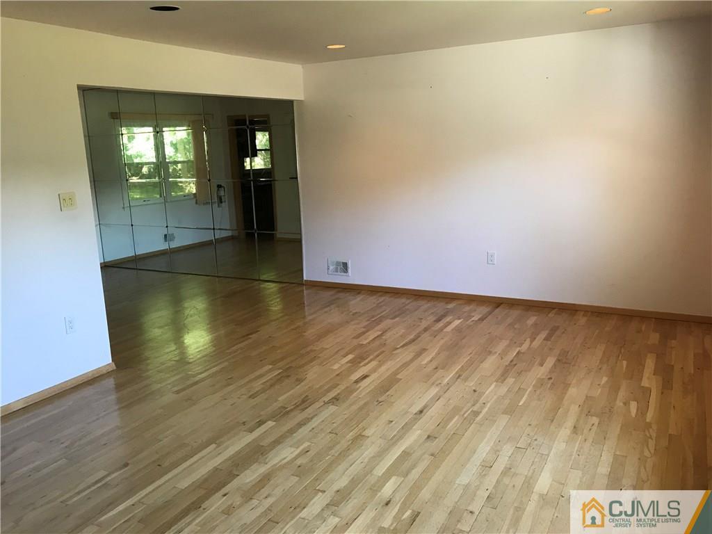 26 Francis Road East Brunswick, NJ 08816 - Photo 8 of 23 a view of a room with wooden floor and seating space