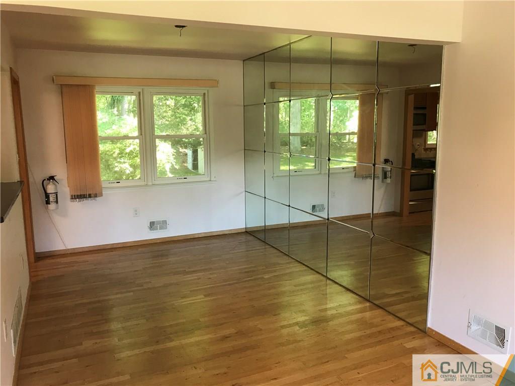 26 Francis Road East Brunswick, NJ 08816 - Photo 9 of 23 a view of a room with wooden floor and windows
