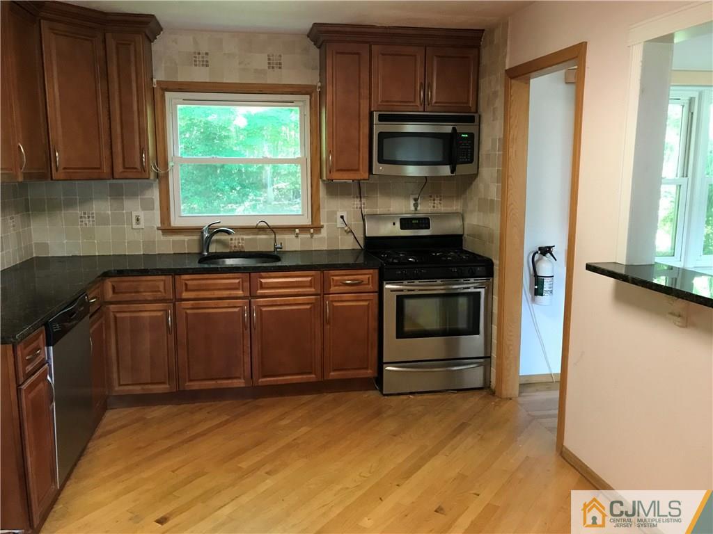 26 Francis Road East Brunswick, NJ 08816 - Photo 10 of 23 a kitchen with a sink stove and microwave