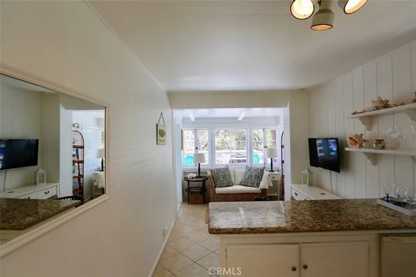 a kitchen with sink and refrigerator