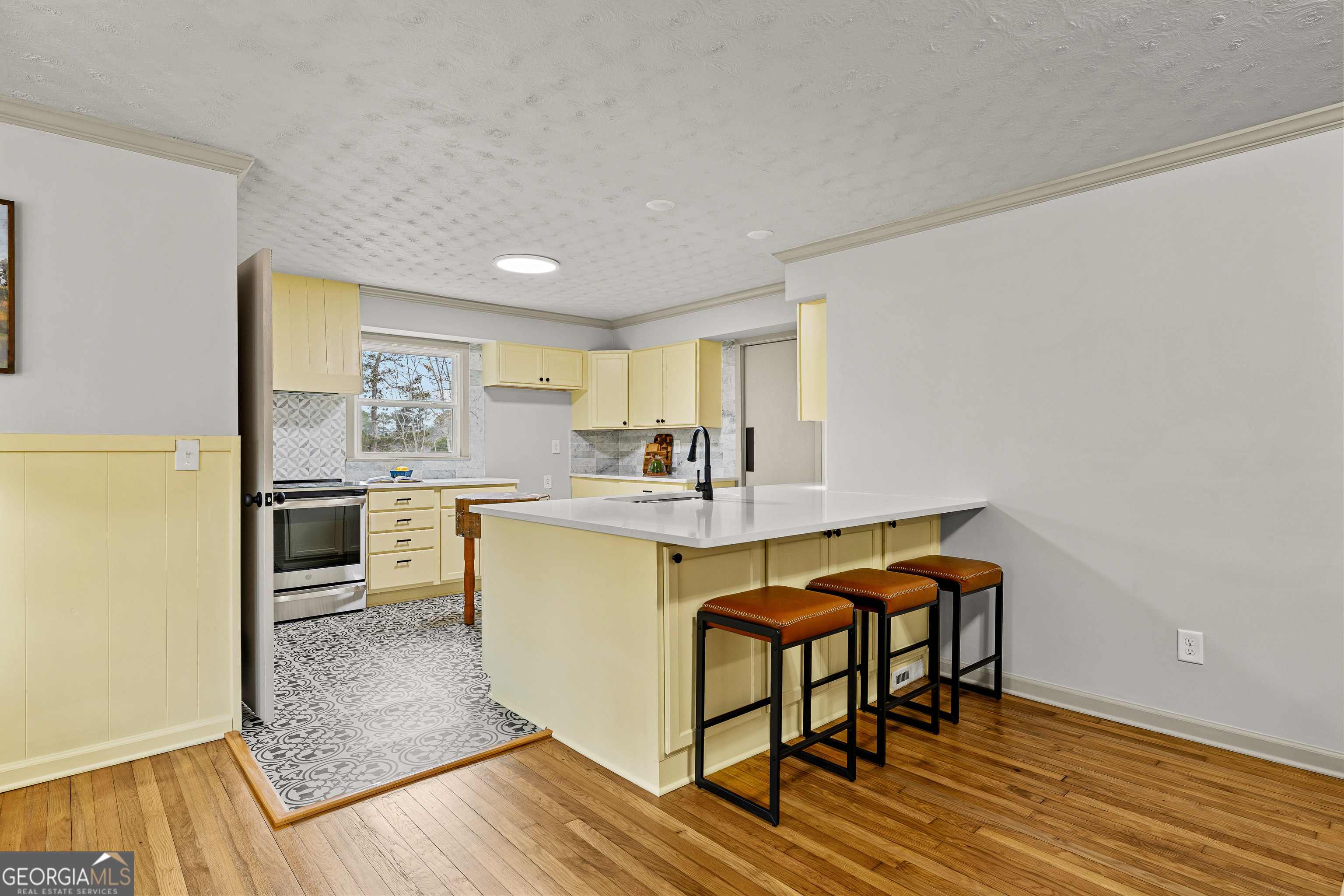 617 Mayes Way Manchester, GA 31816 - Photo 18 of 34 a kitchen with granite countertop a sink cabinets and wooden floor