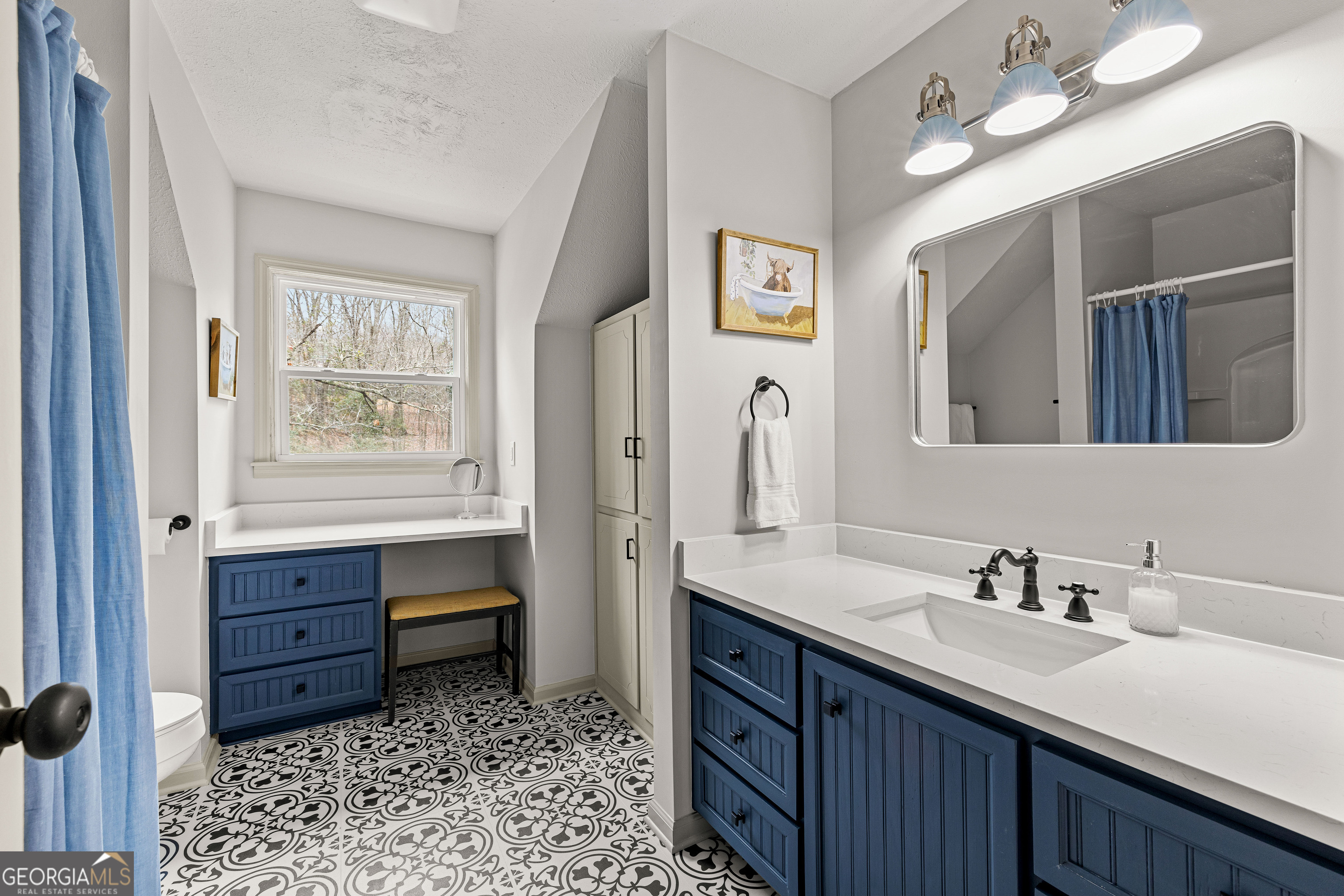 617 Mayes Way Manchester, GA 31816 - Photo 28 of 34 a bathroom with a sink a vanity and a mirror