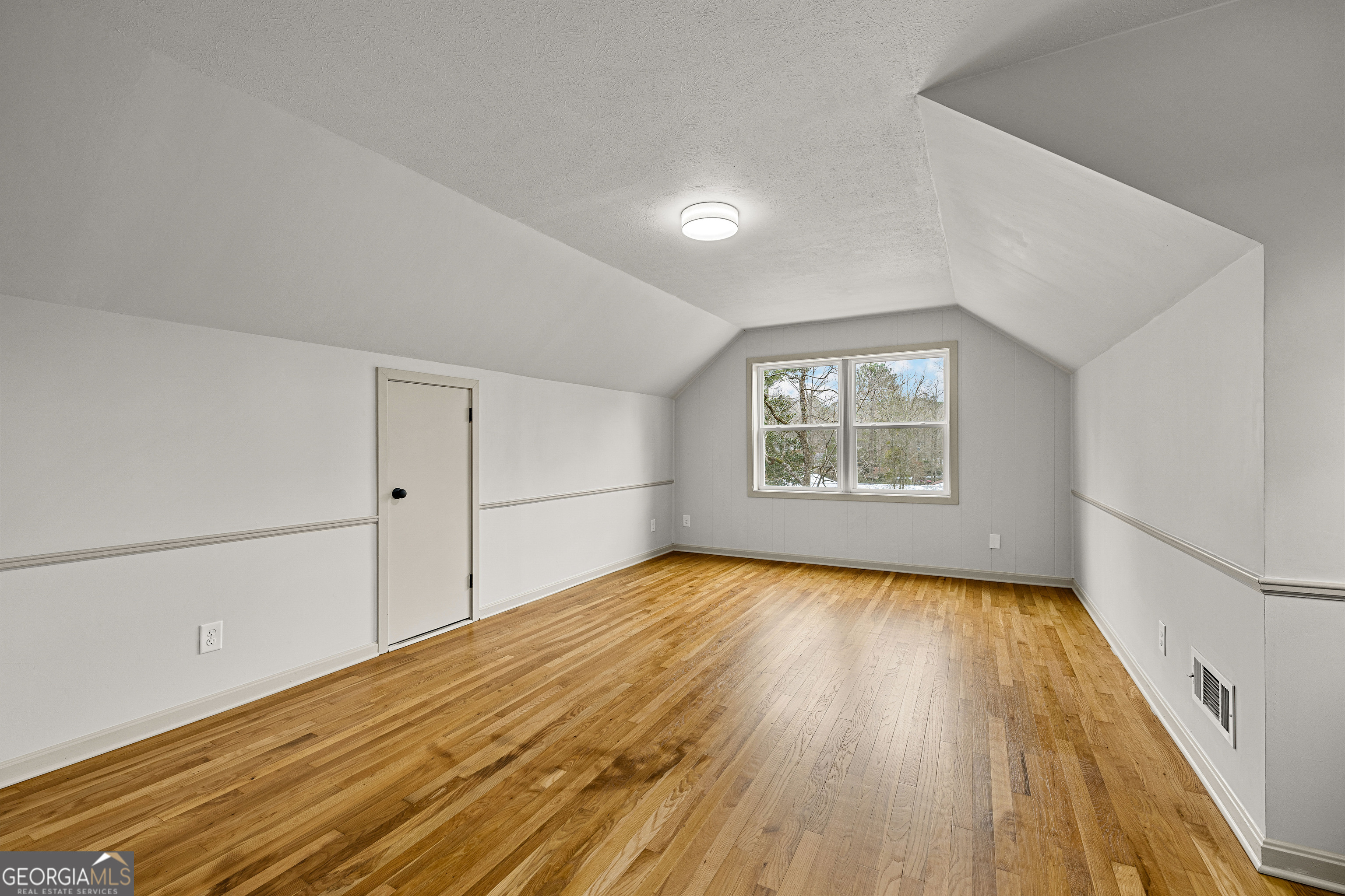 617 Mayes Way Manchester, GA 31816 - Photo 29 of 34 wooden floor in an empty room with a window