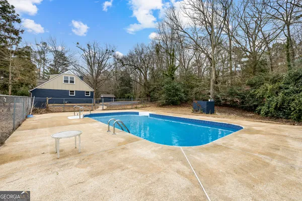 a view of outdoor space and swimming pool