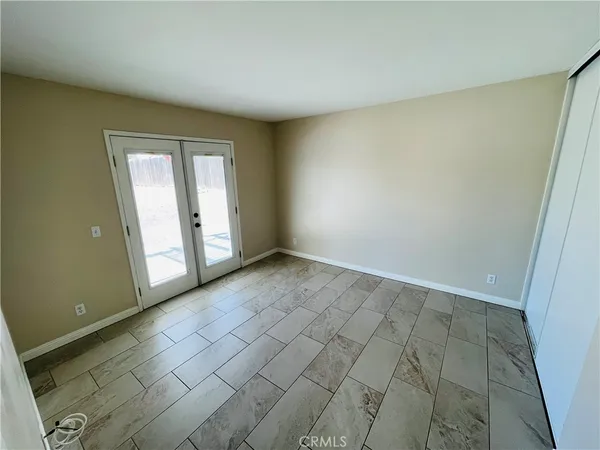 an empty room with a bench