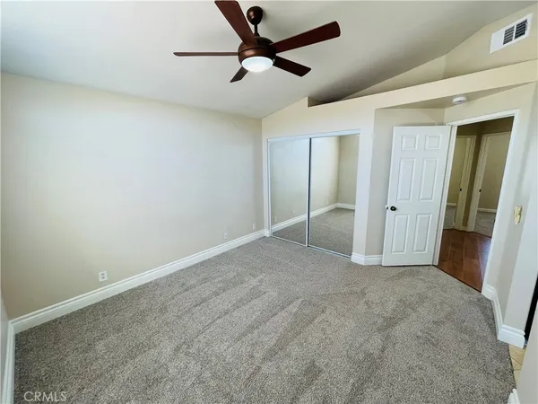 a spacious bathroom with a sink and a mirror
