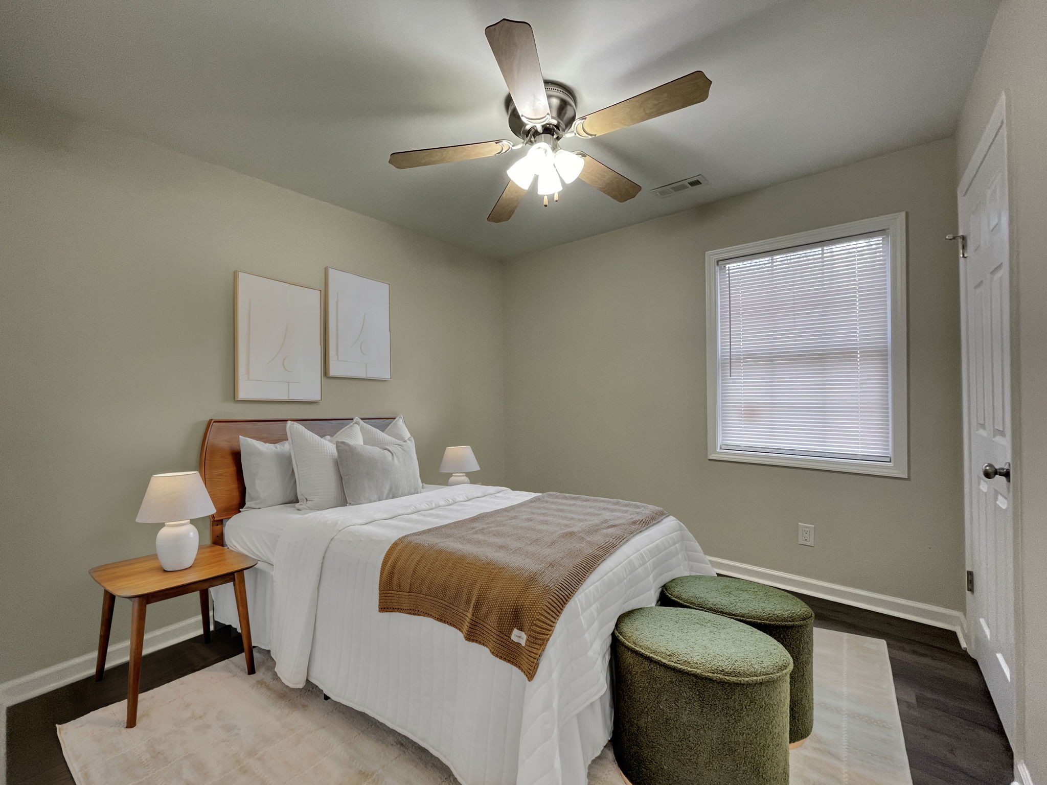 3060 Lylewood Road Woodlawn, TN 37191 - Photo 21 of 56 a bedroom with a bed and a chandelier