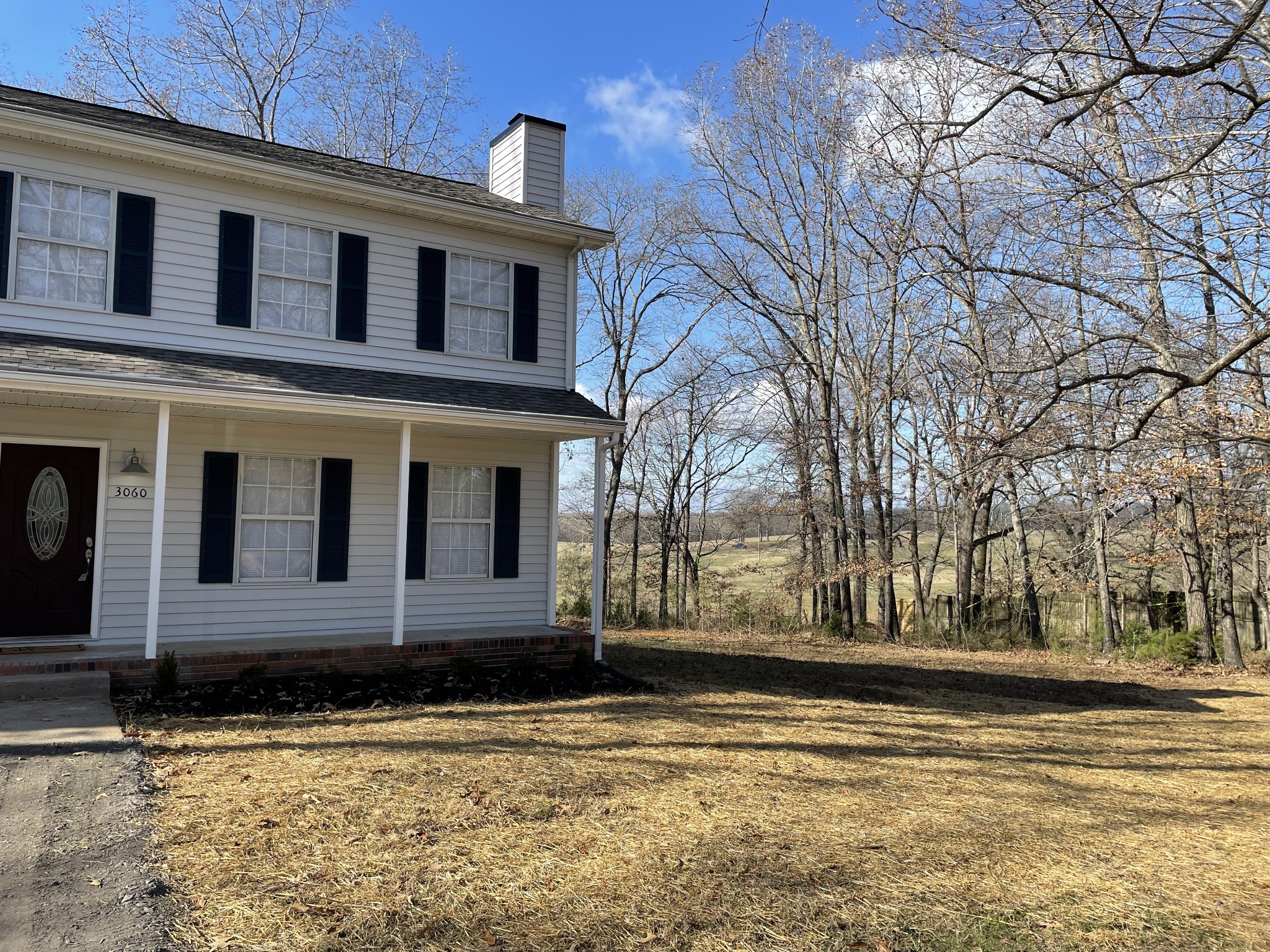 3060 Lylewood Road Woodlawn, TN 37191 - Photo 33 of 56 a front view of a house with a yard