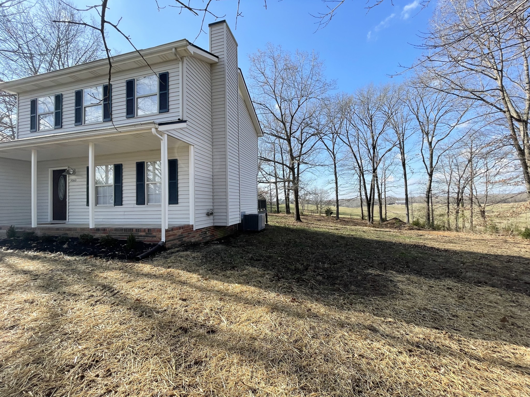 3060 Lylewood Road Woodlawn, TN 37191 - Photo 35 of 56 a view of a house with a yard