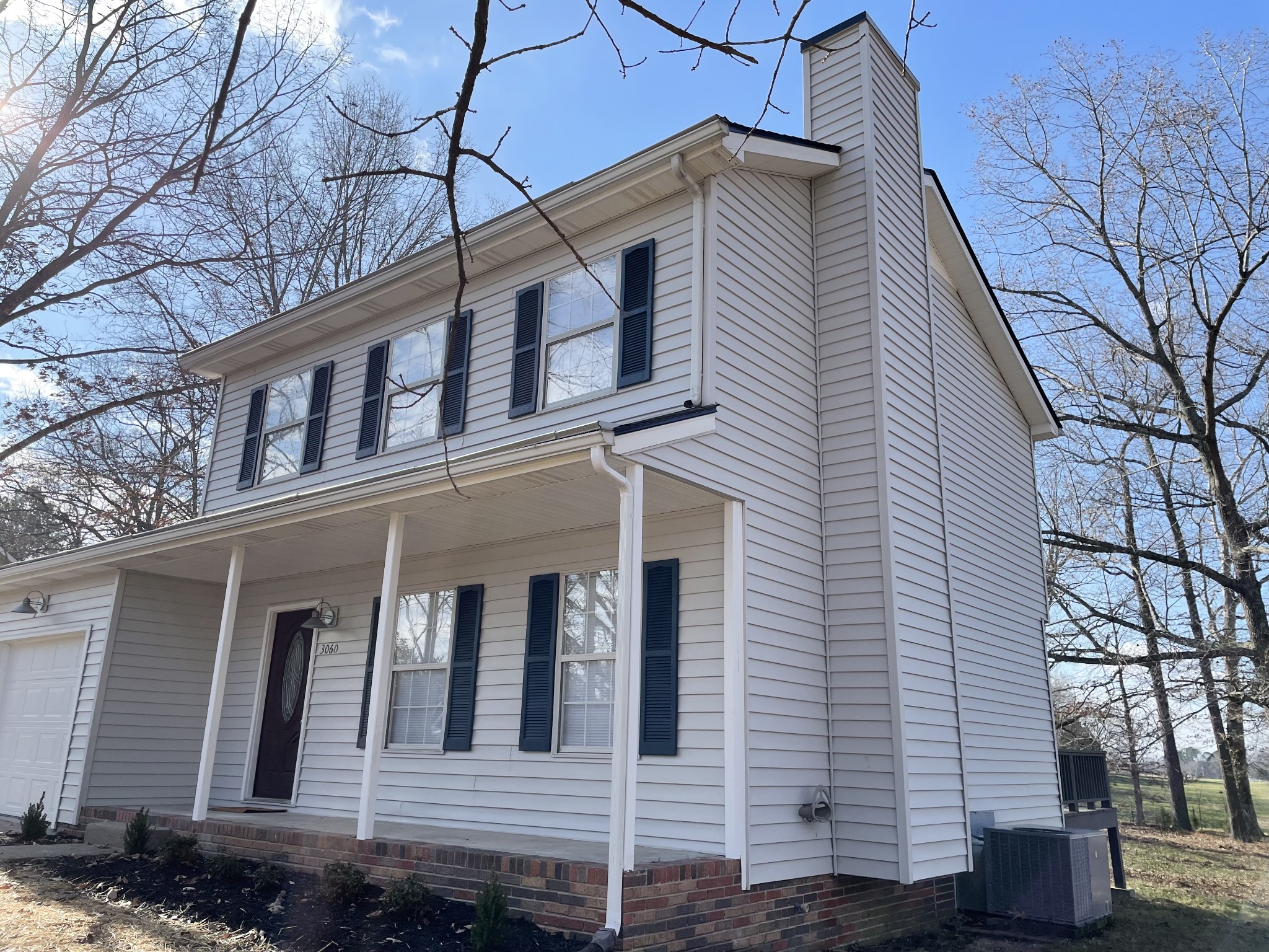 3060 Lylewood Road Woodlawn, TN 37191 - Photo 36 of 56 a front view of a house with a yard