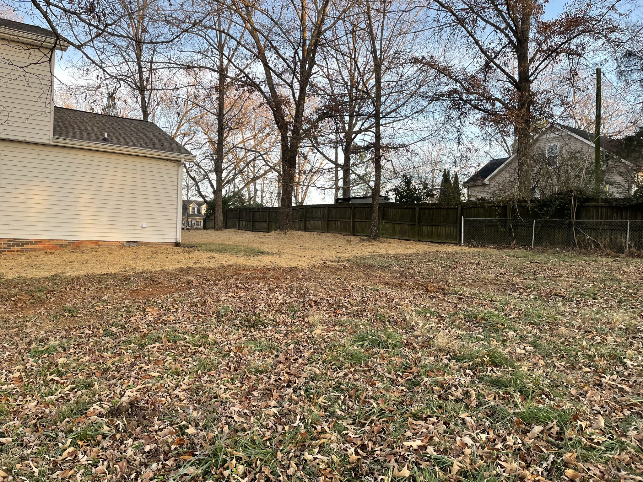 3060 Lylewood Road Woodlawn, TN 37191 - Photo 47 of 56 a backyard of a house with lots of plants and trees
