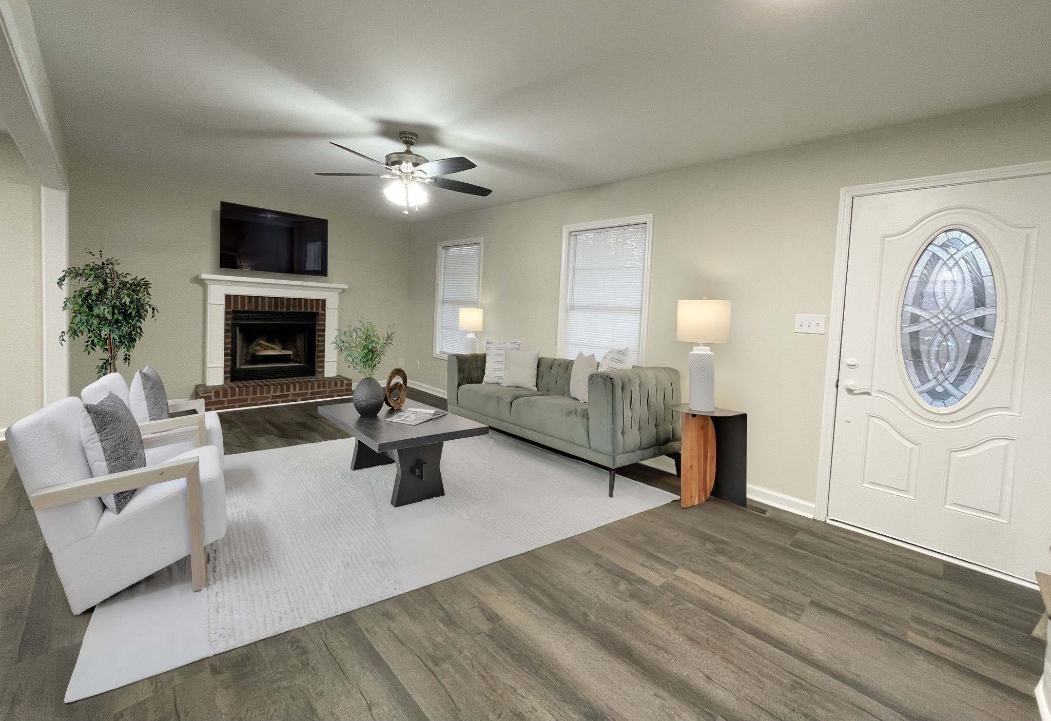 3060 Lylewood Road Woodlawn, TN 37191 - Photo 5 of 56 a living room with furniture a fireplace and a ceiling fan