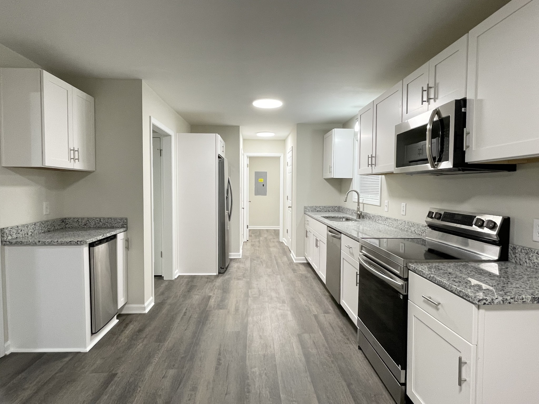 3060 Lylewood Road Woodlawn, TN 37191 - Photo 9 of 56 a large kitchen with stainless steel appliances granite countertop a stove a sink and a refrigerator