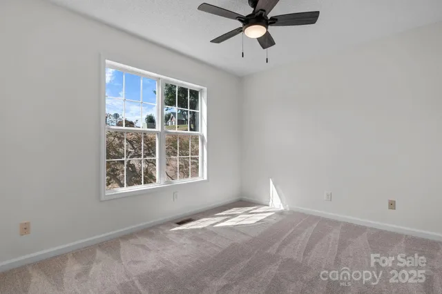 a view of empty room with windows