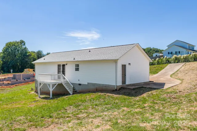 a view of a backyard of the house
