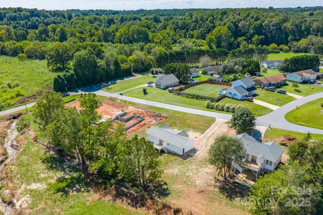a view of a swimming pool with a yard