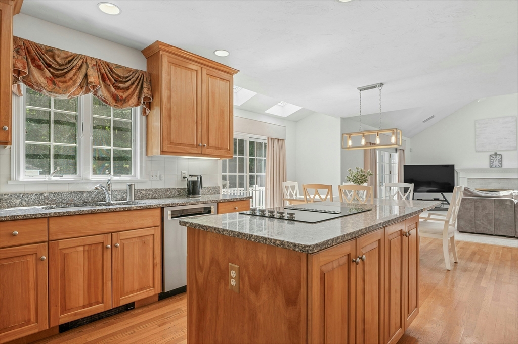 10 Burnett Road Southborough, MA 01772 - Photo 11 of 42 a kitchen with granite countertop a sink stove and cabinets
