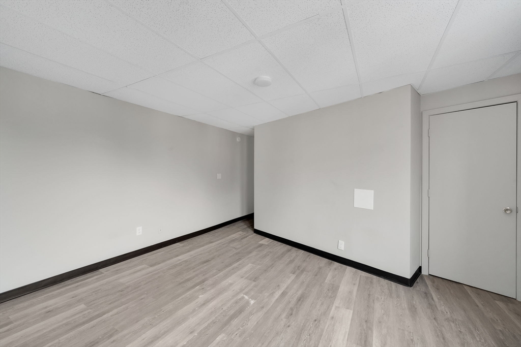 192-198 White Street Springfield, MA 01108 - Photo 22 of 29 a view of an empty room with wooden floor