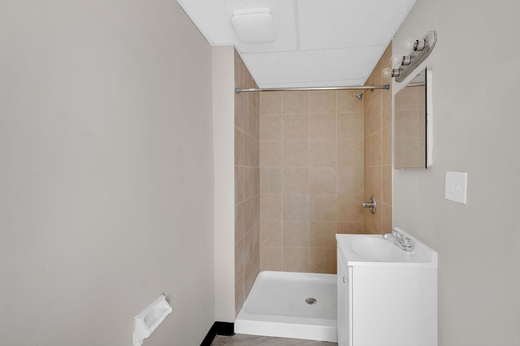 192-198 White Street Springfield, MA 01108 - Photo 25 of 29 a bathroom with a shower and a sink