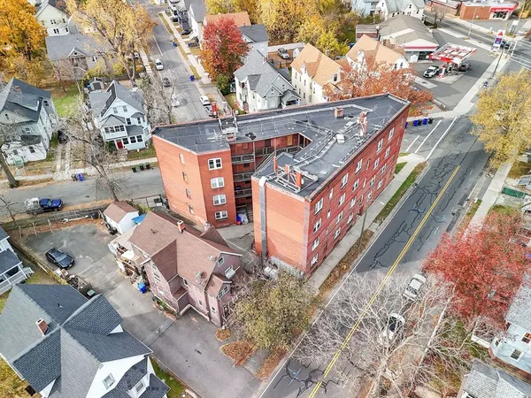 an aerial view of a house with a yard