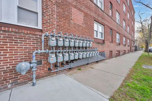 a view of a brick building with many windows