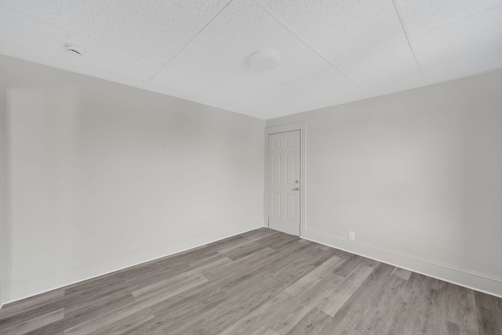 192-198 White Street Springfield, MA 01108 - Photo 8 of 29 a view of an empty room with wooden floor