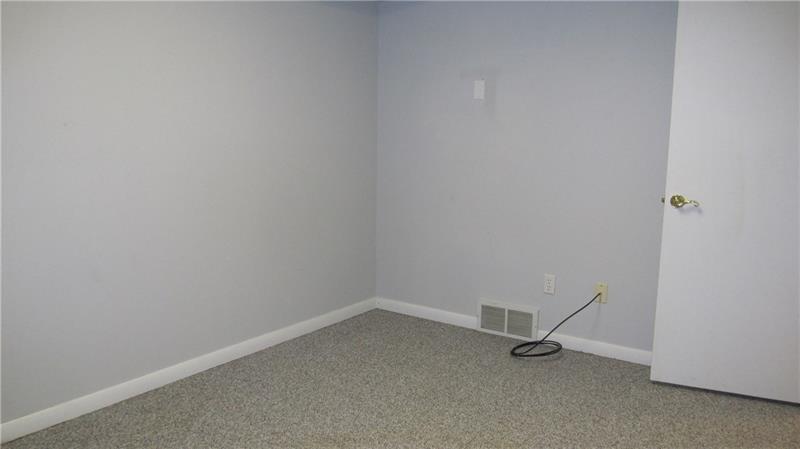 202 Center Church Road Grove City, PA 16127 - Photo 22 of 25 Lower level 5th bedroom. All bedrooms are painted a nice, neutral color. There is also a full bath on the lower level.