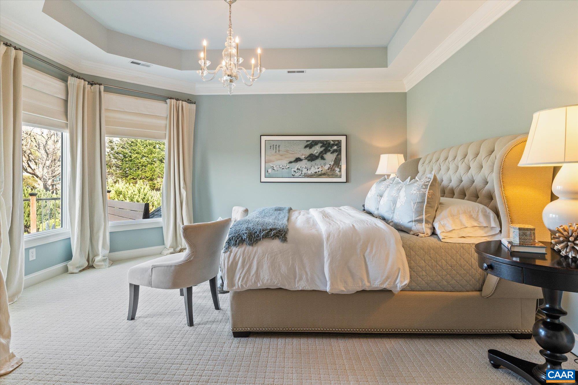 3150 Rocks Farm Court Charlottesville, VA 22903 - Photo 45 of 74 a bedroom with a bed and a chandelier