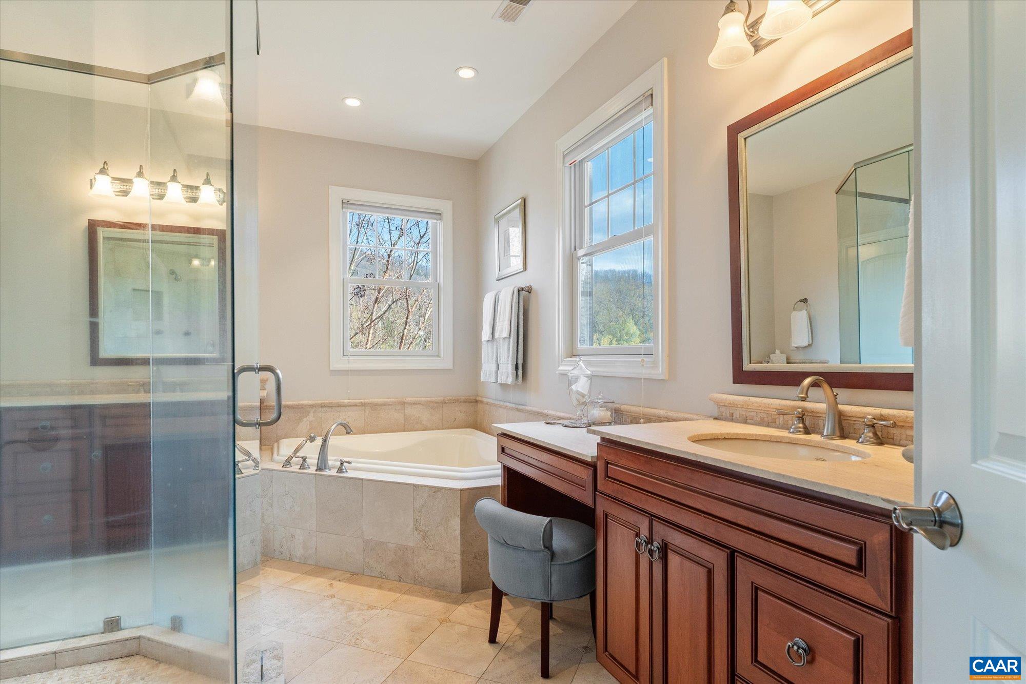 3150 Rocks Farm Court Charlottesville, VA 22903 - Photo 47 of 74 a spacious bathroom with a double vanity sink a mirror and a bathtub