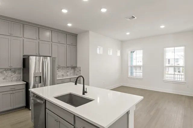 a kitchen with sink and window