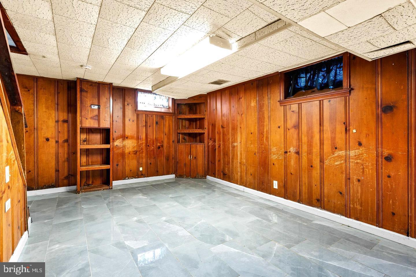 1300 North Potomac Street Baltimore, MD 21213 - Photo 12 of 20 a view of an empty room with wooden walls