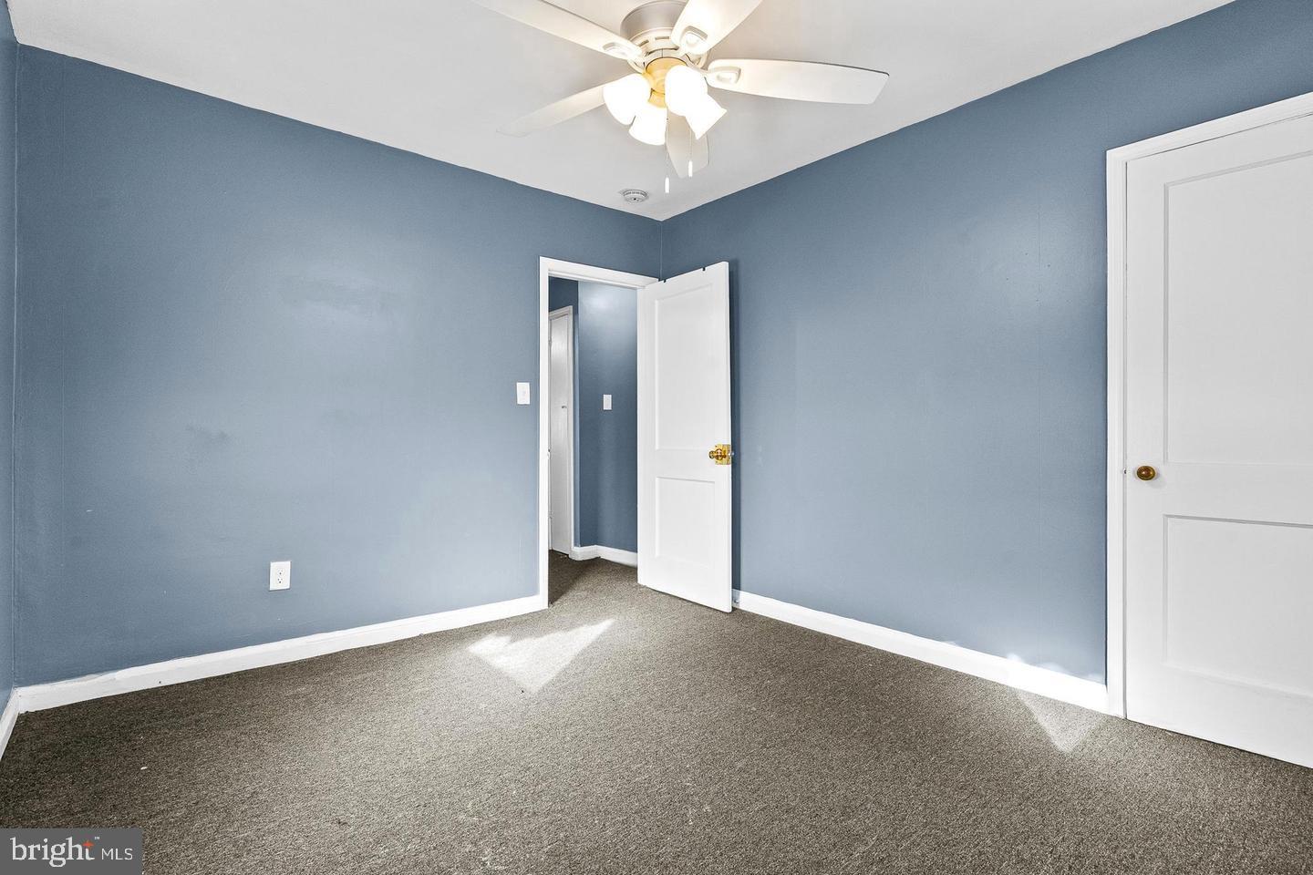 1300 North Potomac Street Baltimore, MD 21213 - Photo 10 of 20 an empty room with closet and a chandelier fan