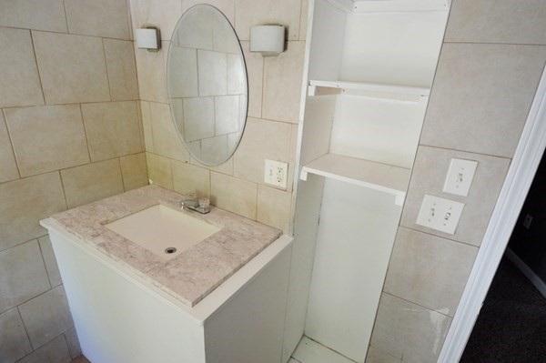 151 Mechanic Street Fitchburg, MA 01420 - Photo 15 of 42 a bathroom with a sink and vanity