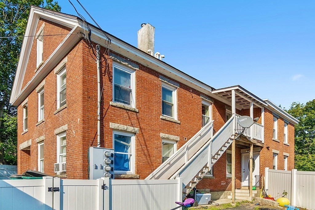 151 Mechanic Street Fitchburg, MA 01420 - Photo 2 of 42 a front view of a building with large windows