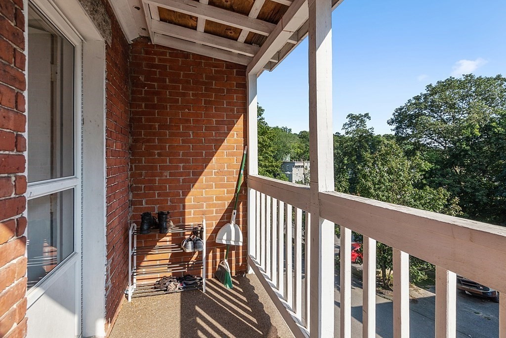 151 Mechanic Street Fitchburg, MA 01420 - Photo 38 of 42 a view of balcony with wooden floor and fence