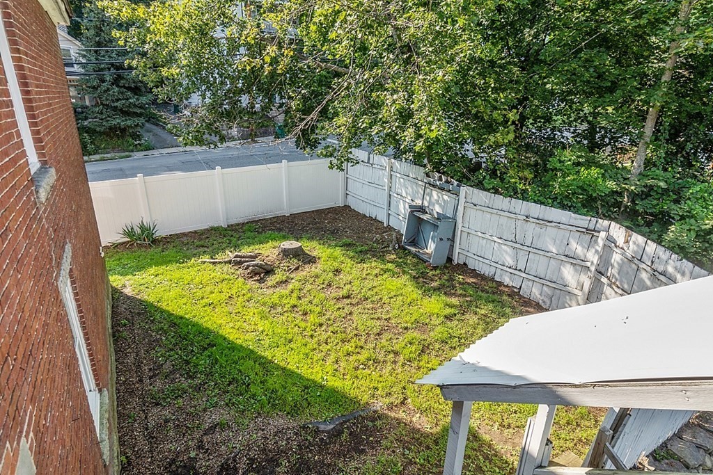 151 Mechanic Street Fitchburg, MA 01420 - Photo 39 of 42 a view of a backyard with wooden fence