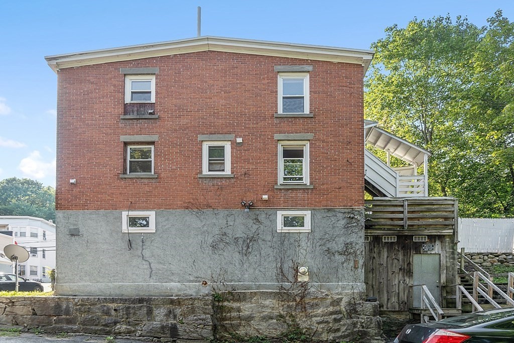 151 Mechanic Street Fitchburg, MA 01420 - Photo 40 of 42 a front view of a building with garden