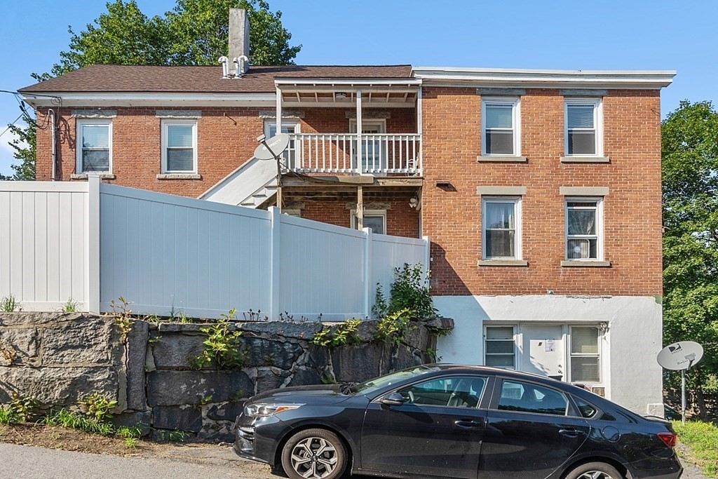151 Mechanic Street Fitchburg, MA 01420 - Photo 42 of 42 front view of a house with a cars