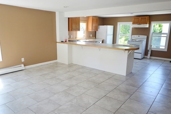 151 Mechanic Street Fitchburg, MA 01420 - Photo 5 of 42 a kitchen with stainless steel appliances a sink and a cabinets