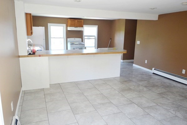 151 Mechanic Street Fitchburg, MA 01420 - Photo 6 of 42 a view of kitchen with granite countertop cabinets and window