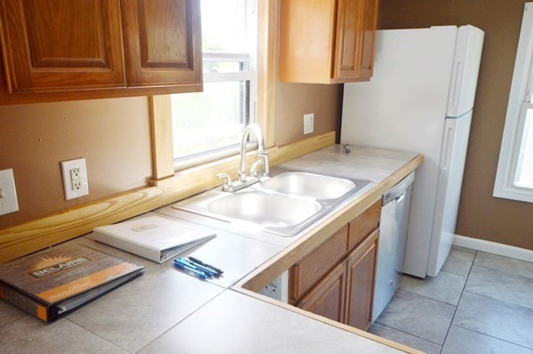 151 Mechanic Street Fitchburg, MA 01420 - Photo 8 of 42 a bathroom with a sink and a mirror