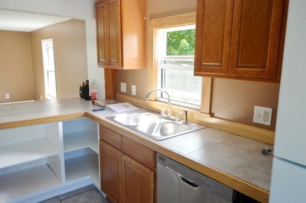 151 Mechanic Street Fitchburg, MA 01420 - Photo 9 of 42 a kitchen with a sink and a window