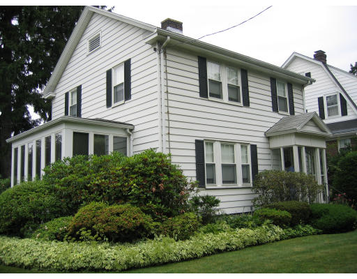 4 Arapahoe Road Newton, MA 02465 - Photo 1 of 5 a front view of a house with a yard