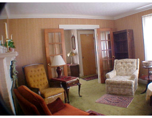 4 Arapahoe Road Newton, MA 02465 - Photo 2 of 5 a living room with furniture and a window