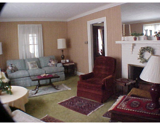 4 Arapahoe Road Newton, MA 02465 - Photo 3 of 5 a living room with furniture and a rug