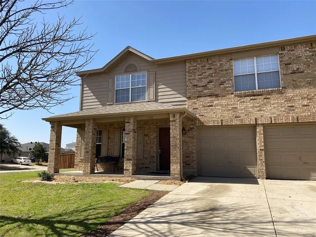 a view of a white house with a large windows