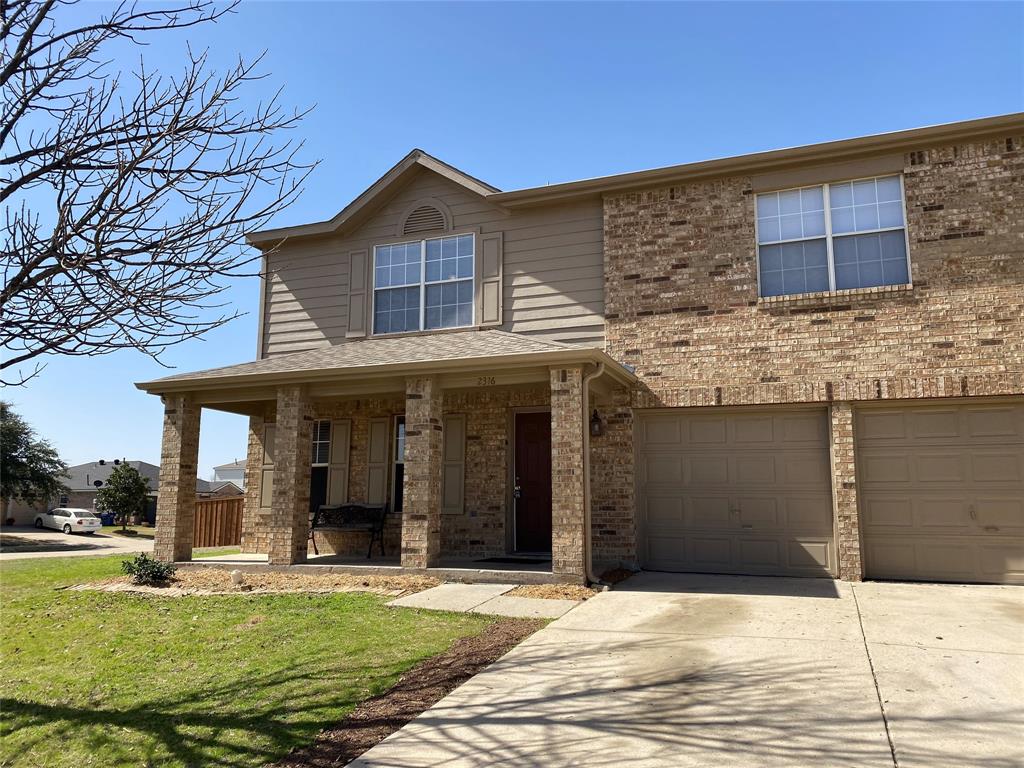 a view of a white house with a large windows