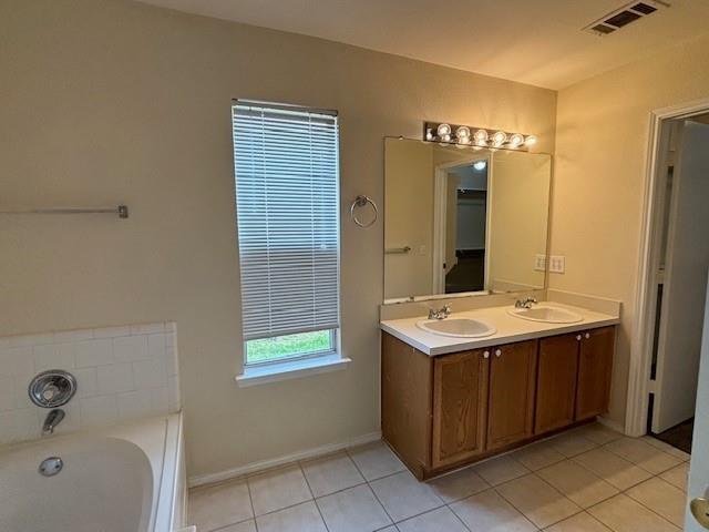 2316 Penton Way Little Elm, TX 75068 - Photo 13 of 22 a bathroom with a sink and a mirror