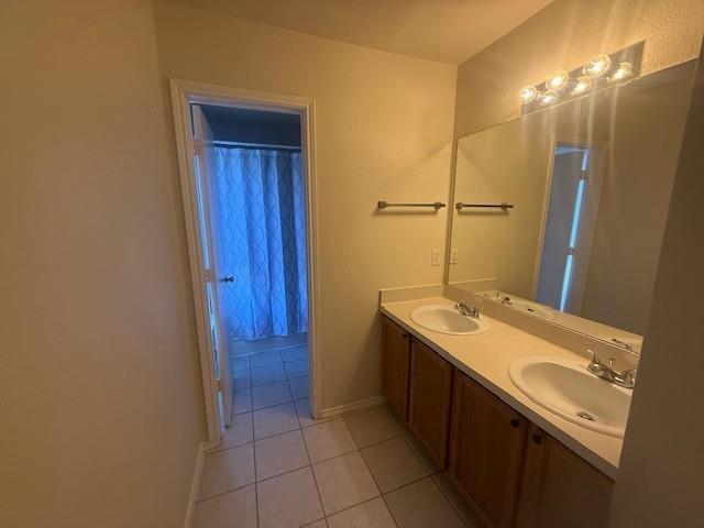 2316 Penton Way Little Elm, TX 75068 - Photo 15 of 22 a bathroom with a sink and a mirror