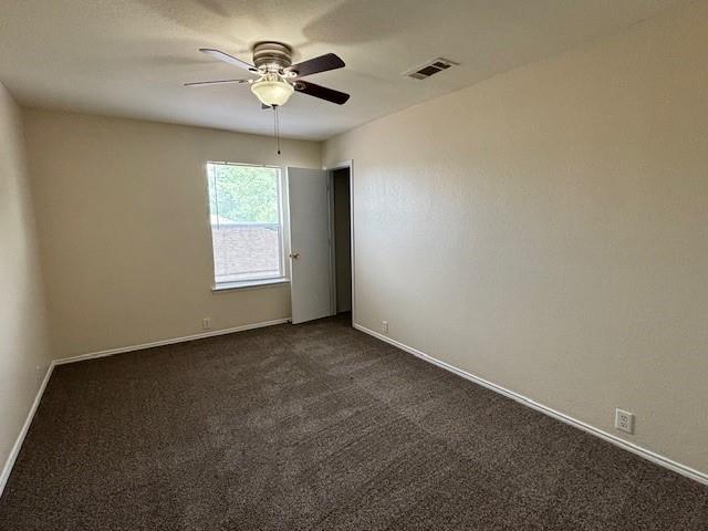 2316 Penton Way Little Elm, TX 75068 - Photo 17 of 22 an empty room with windows and fan